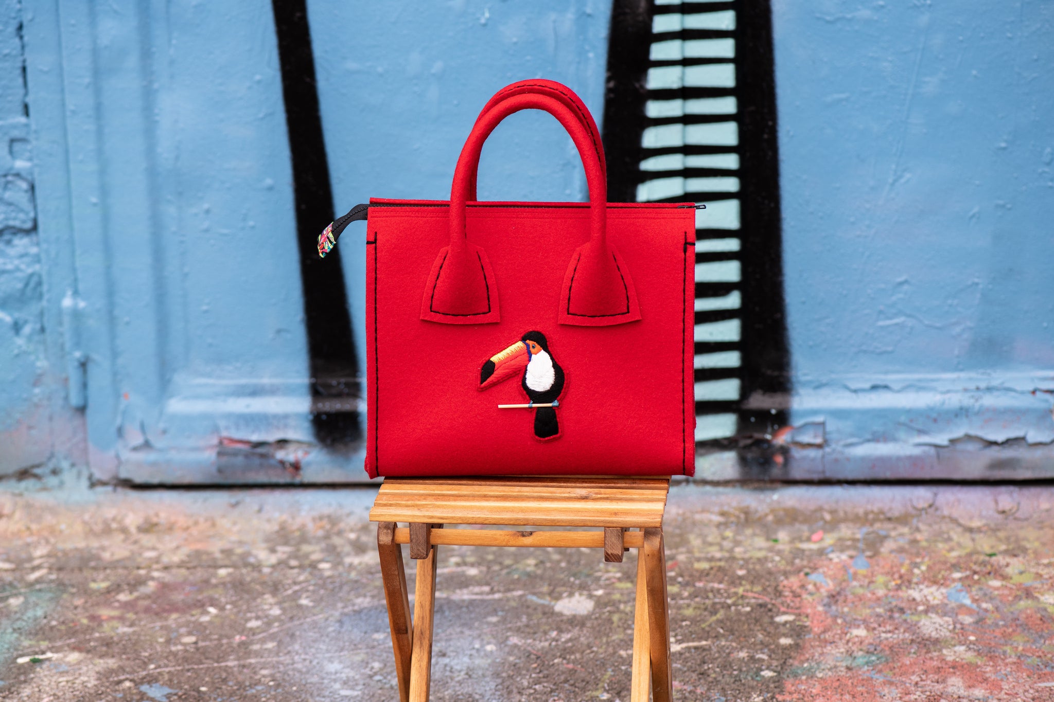 Luxury and hand-embroidered felt handbag, made in Luxembourg.